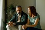 Mature couple fighting at home sitting on the sofa.